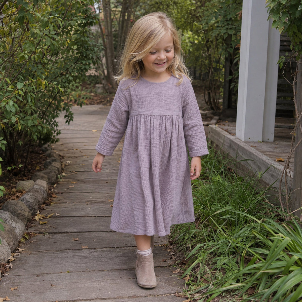 Lavender double gauze toddler dress in garden
