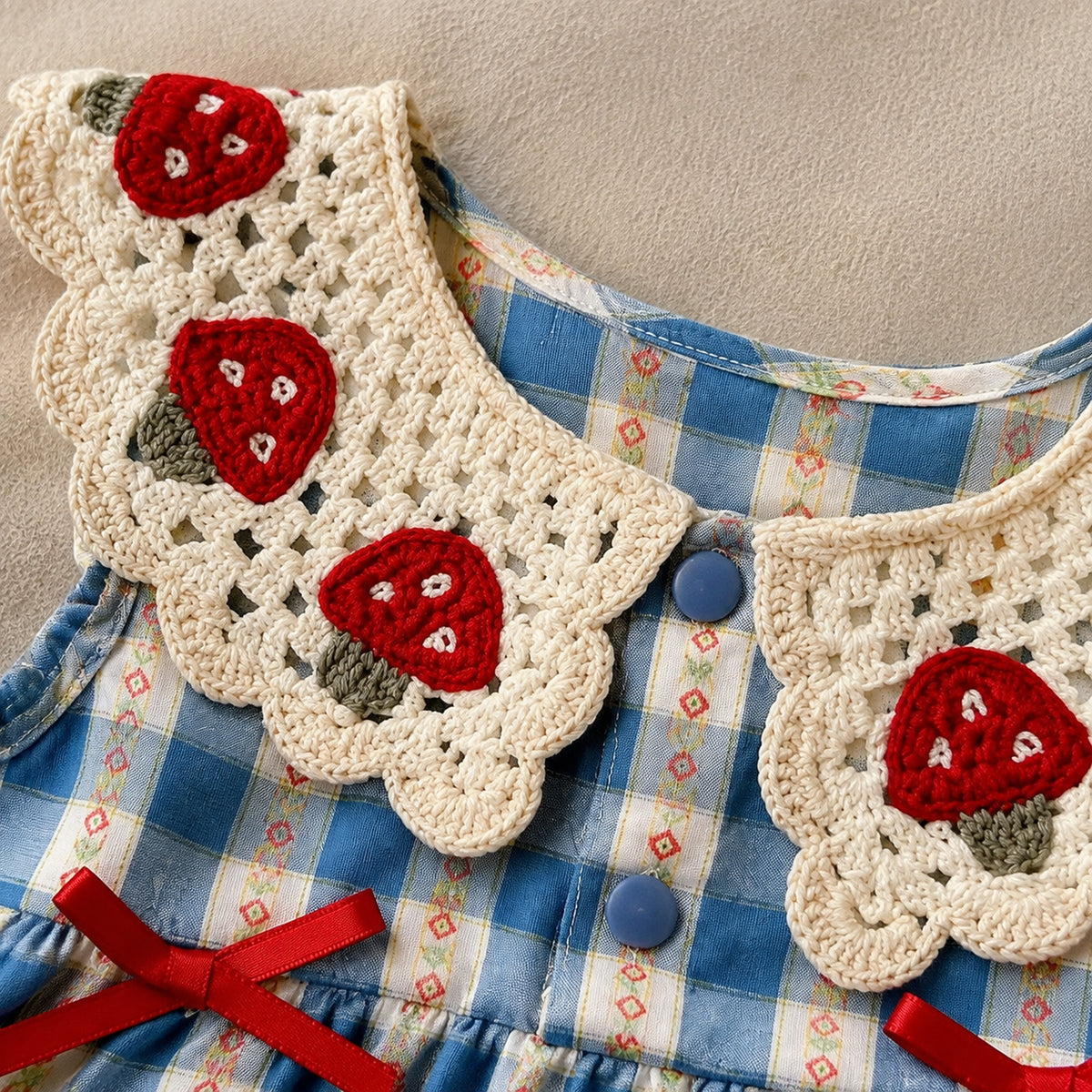Baby blue gingham romper dress with crochet strawberry collar and red bows - collar and bodice detail