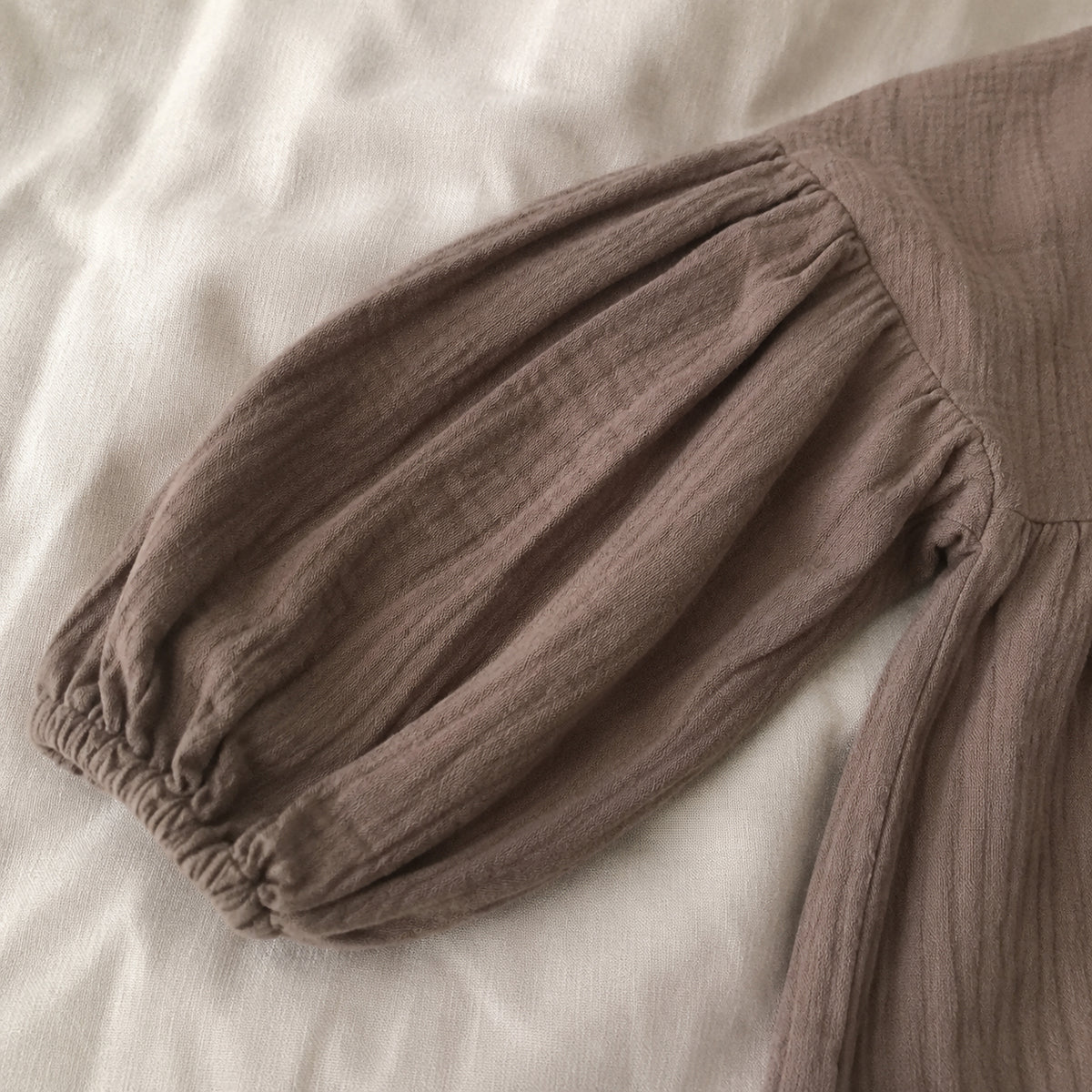 Brown lantern sleeve and elastic cuff detail