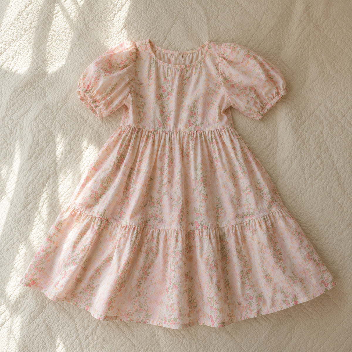 Full ivory pink rose floral puff-sleeve midi dress shown in a natural flatlay