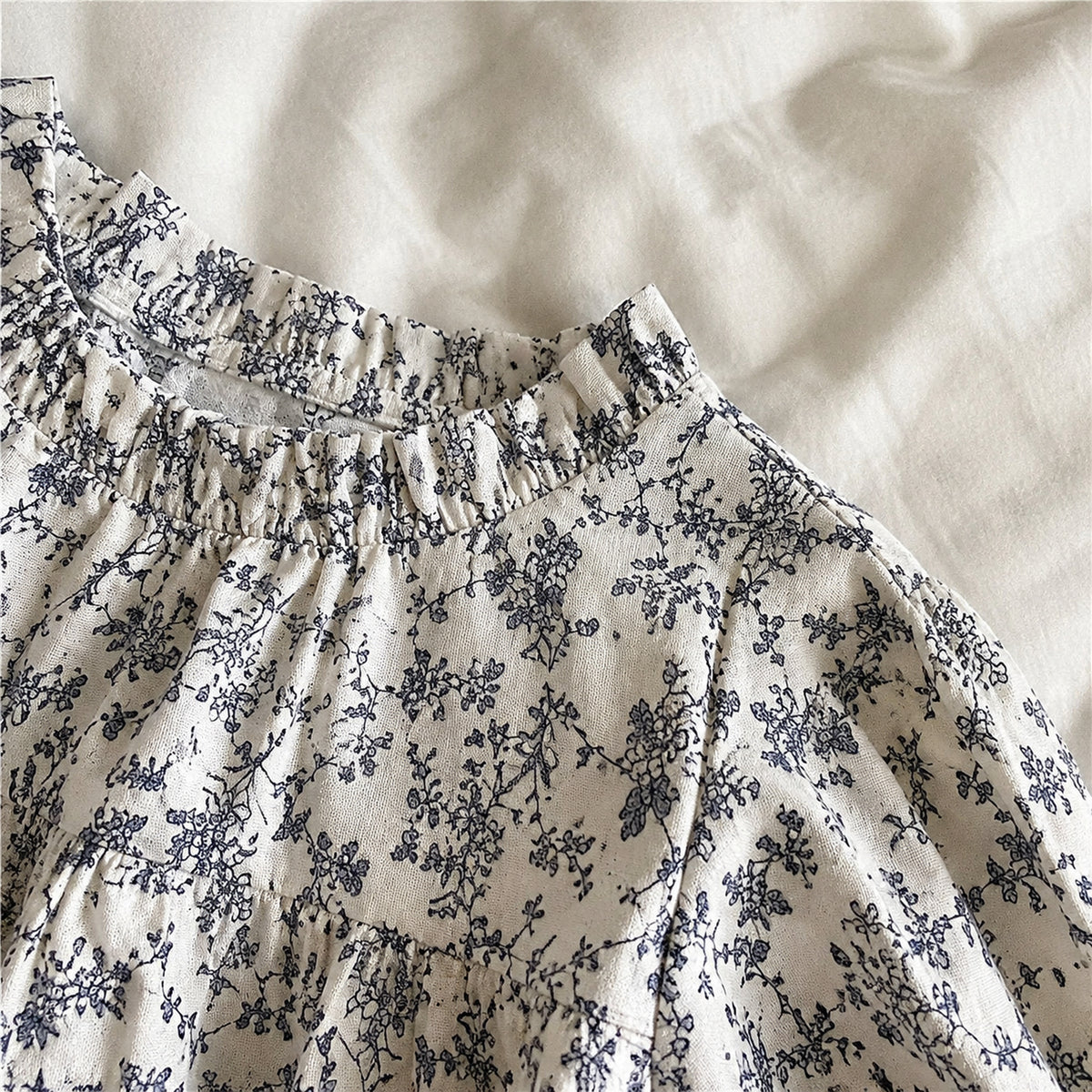 Girls powder blue lace cardigan and ivory blue floral long sleeve dress - fabric and trim close-up