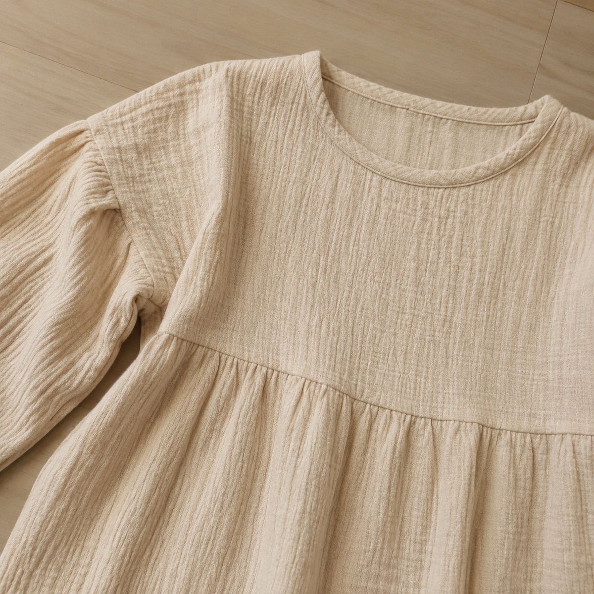 Beige muslin dress neckline and gathered waist