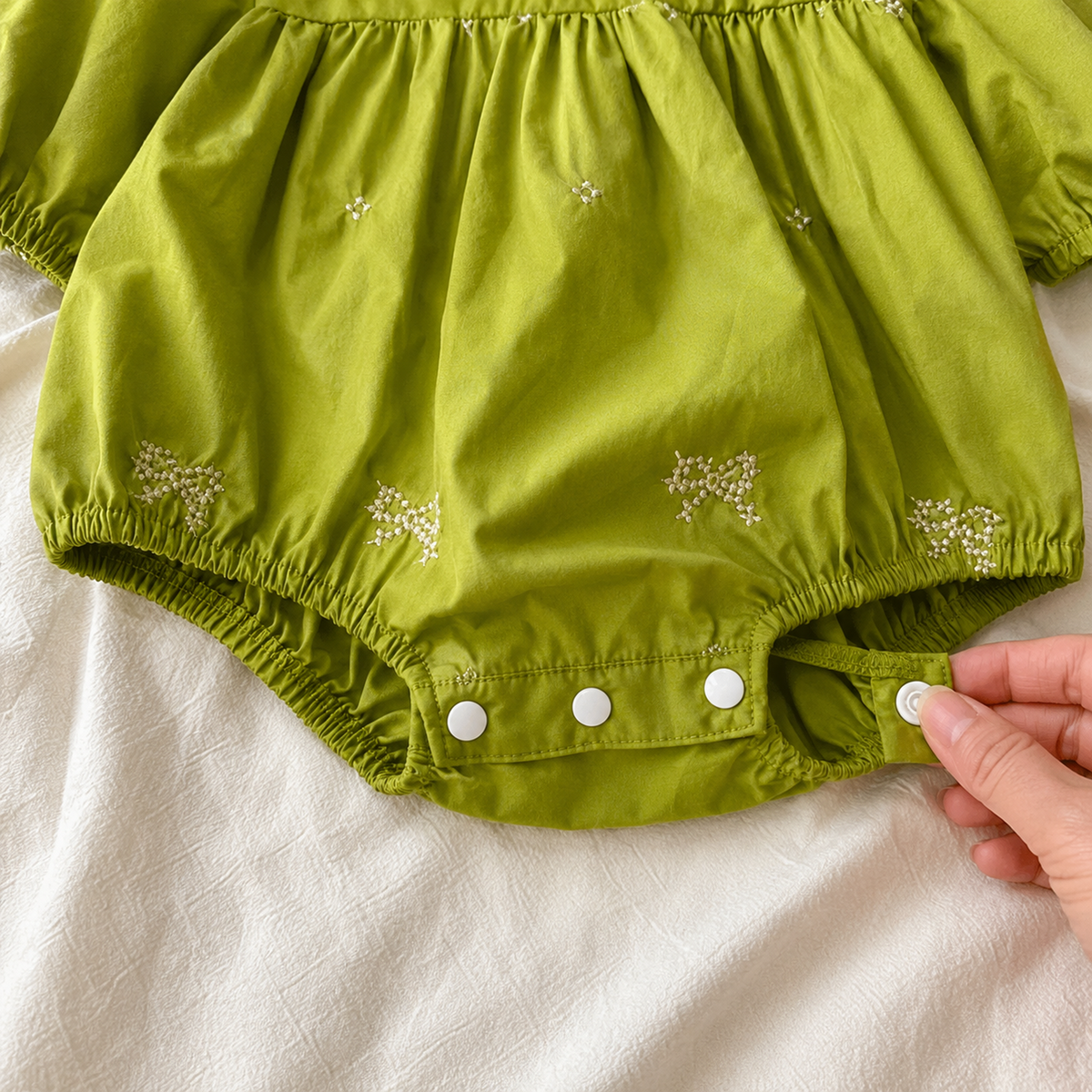 Bubble romper elastic leg and snap closure detail
