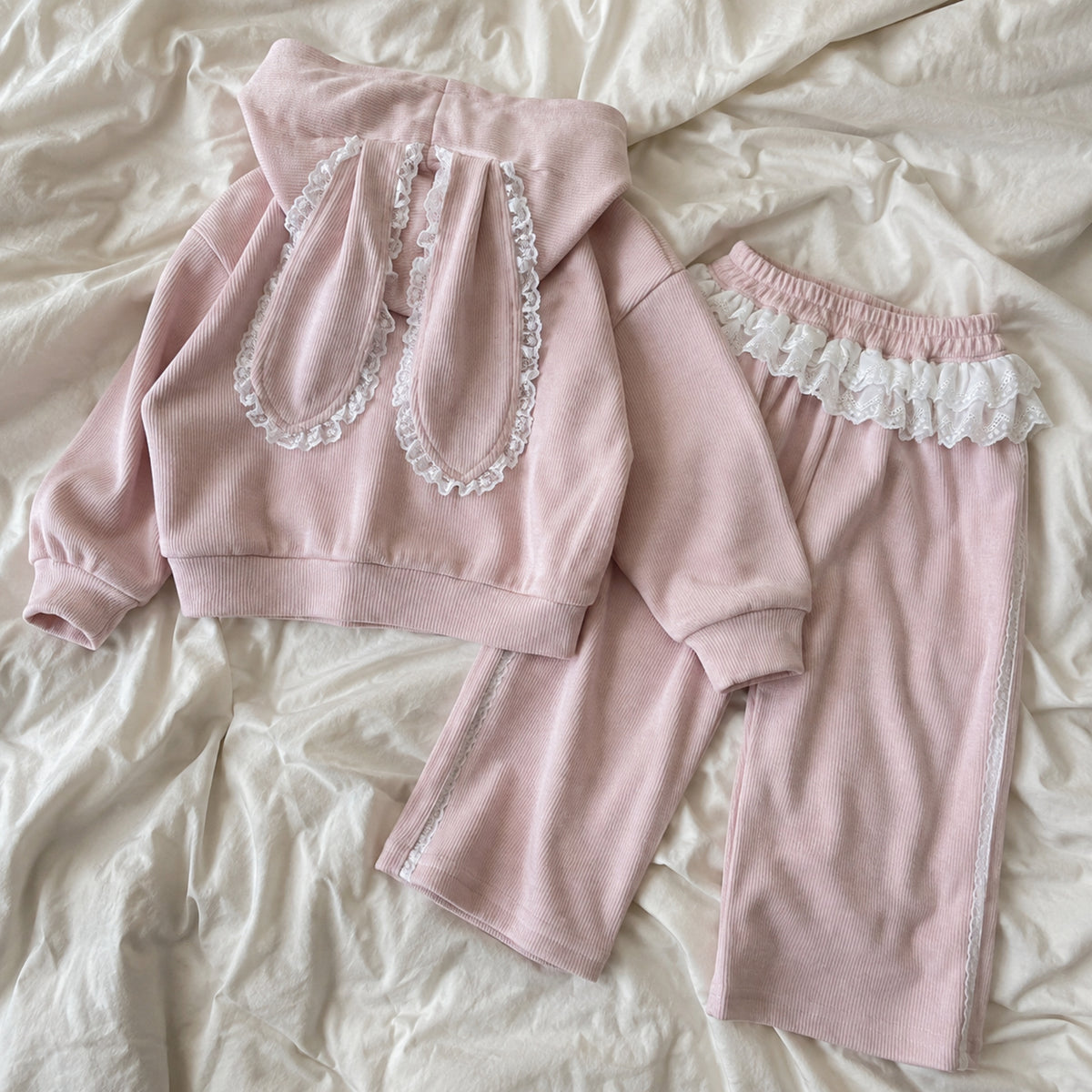 Back view of the complete pink bunny hoodie and ruffle pants set