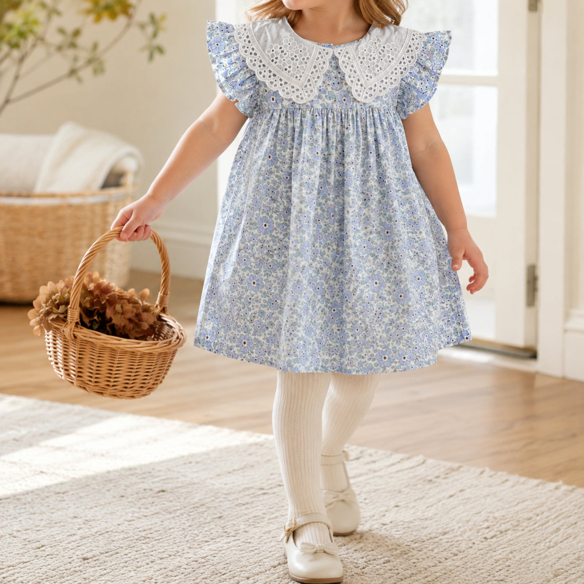 Girl wearing blue floral dress with cream tights