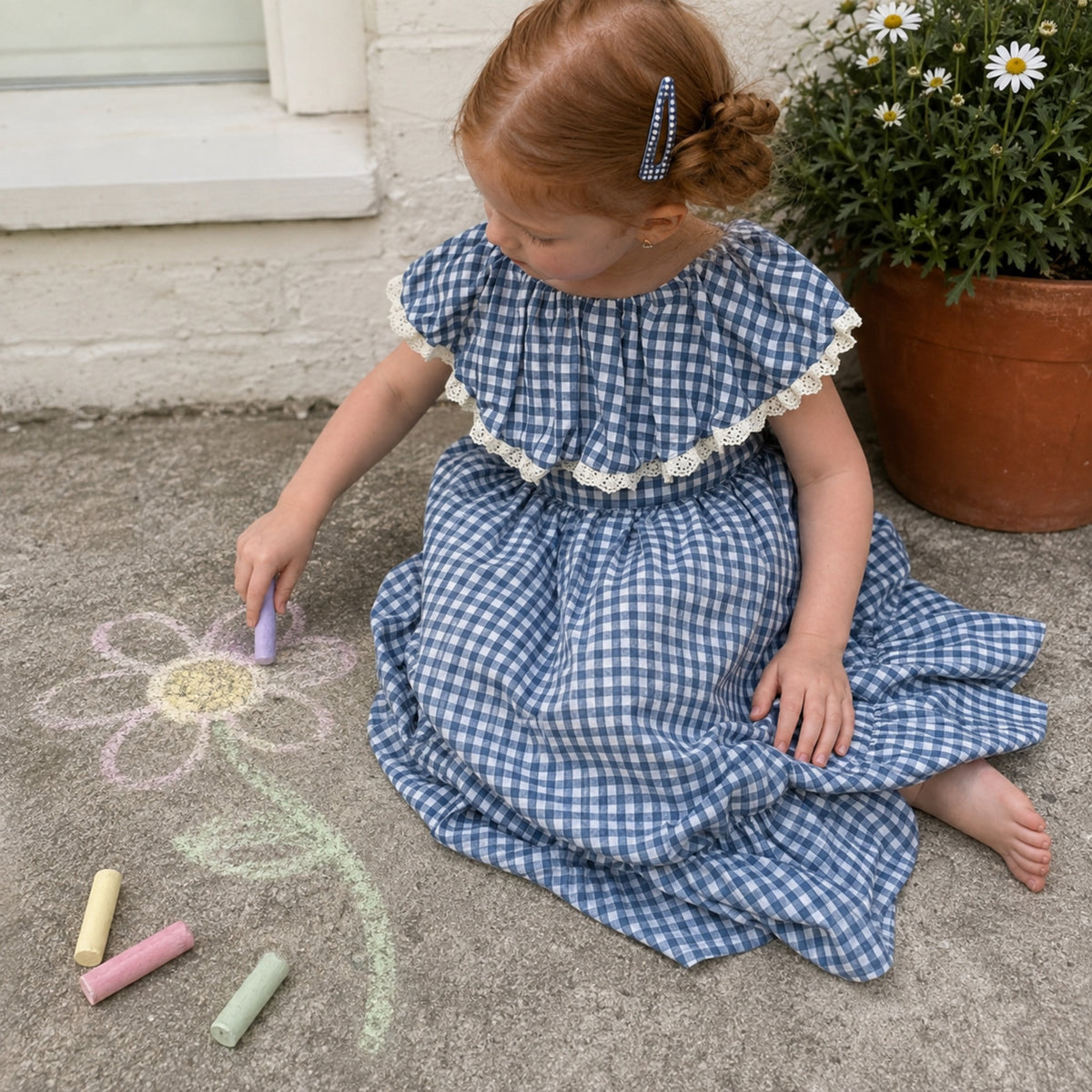 Navy gingham dress during porch chalk play