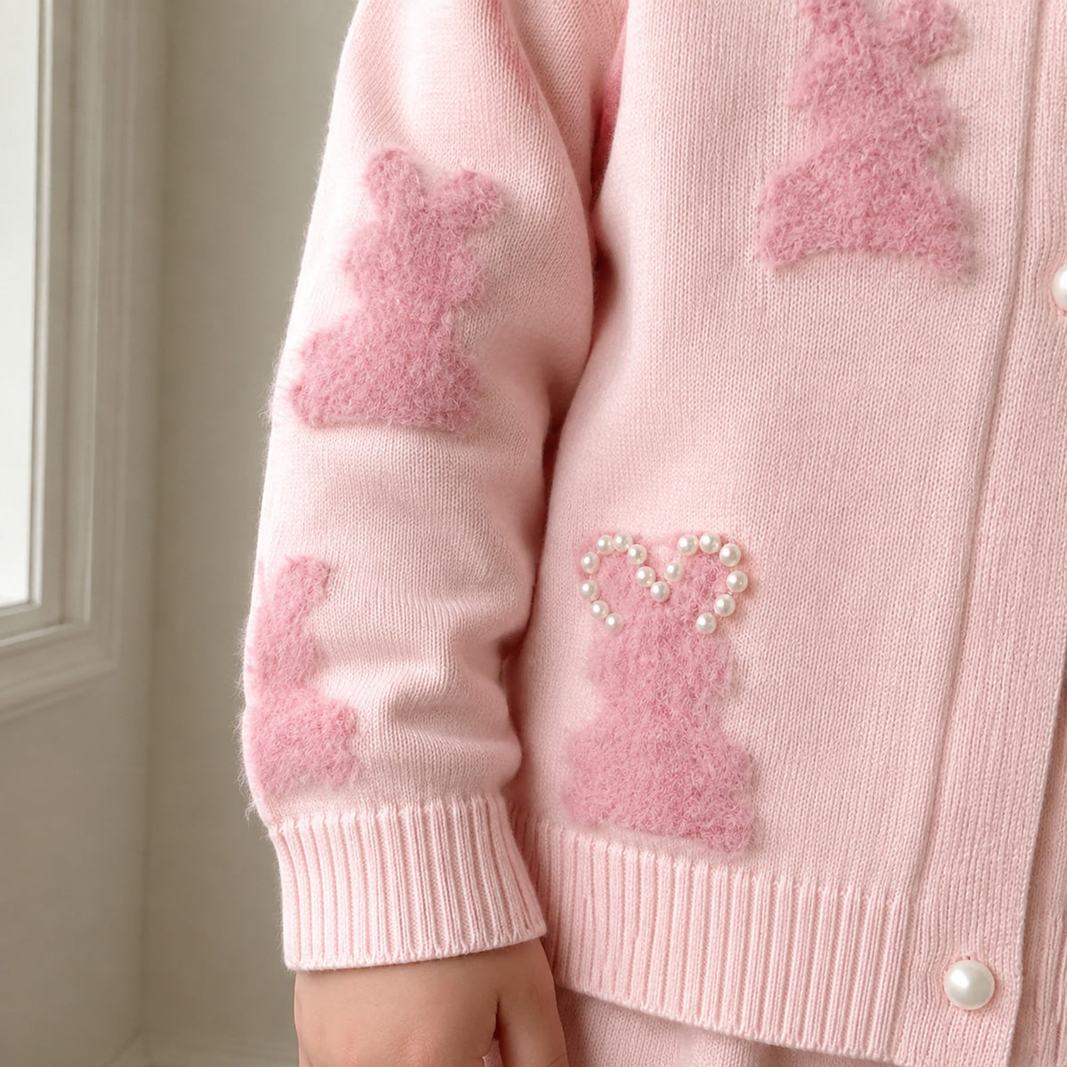 Sleeve cuff and bunny motif detail on girls pink cardigan