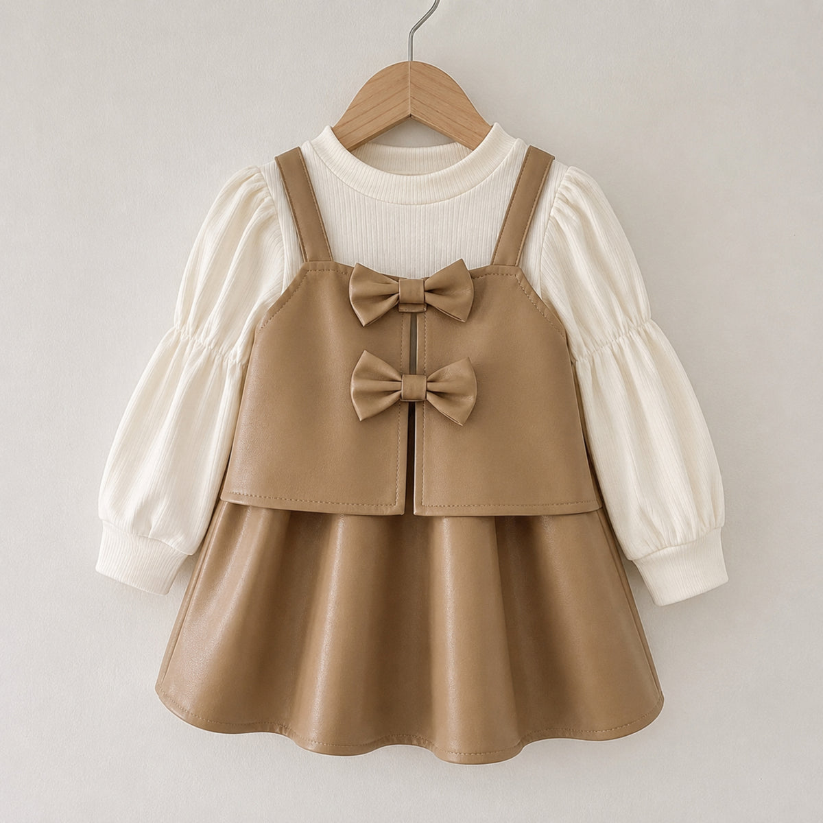Camel tan girls faux leather pinafore dress hanging front view