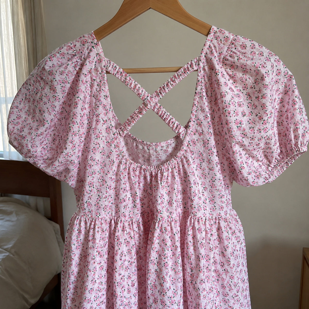 Close-up of the pink floral dress crisscross open-back detail