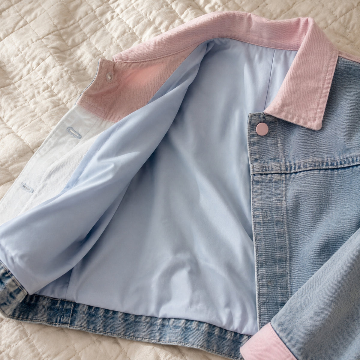 Close-up of the soft cotton-rich lining inside the pastel denim jacket