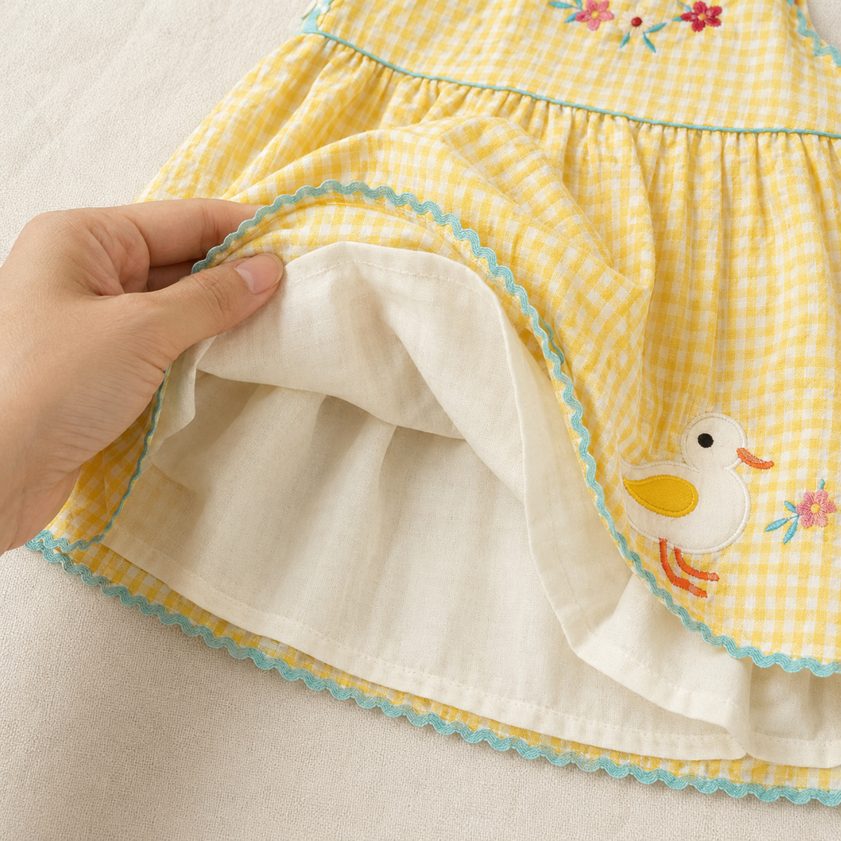 Soft light-colored lining inside yellow gingham dress