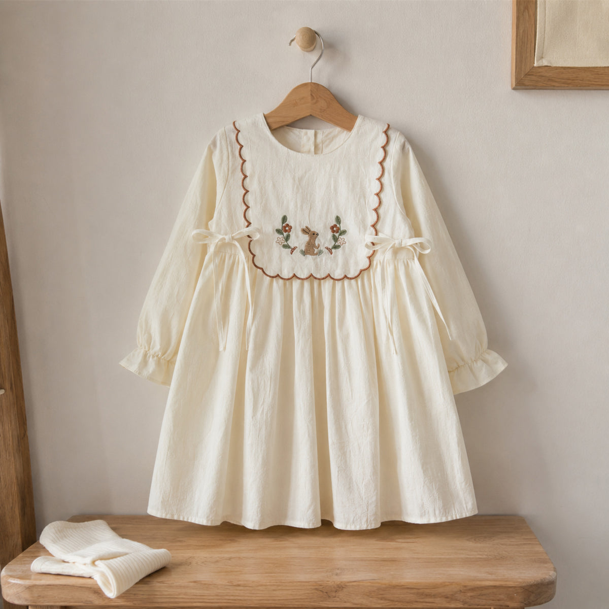 Girls Ivory Embroidered Cotton Dress, Long Sleeve Fall Toddler Outfit — wooden hanger product view