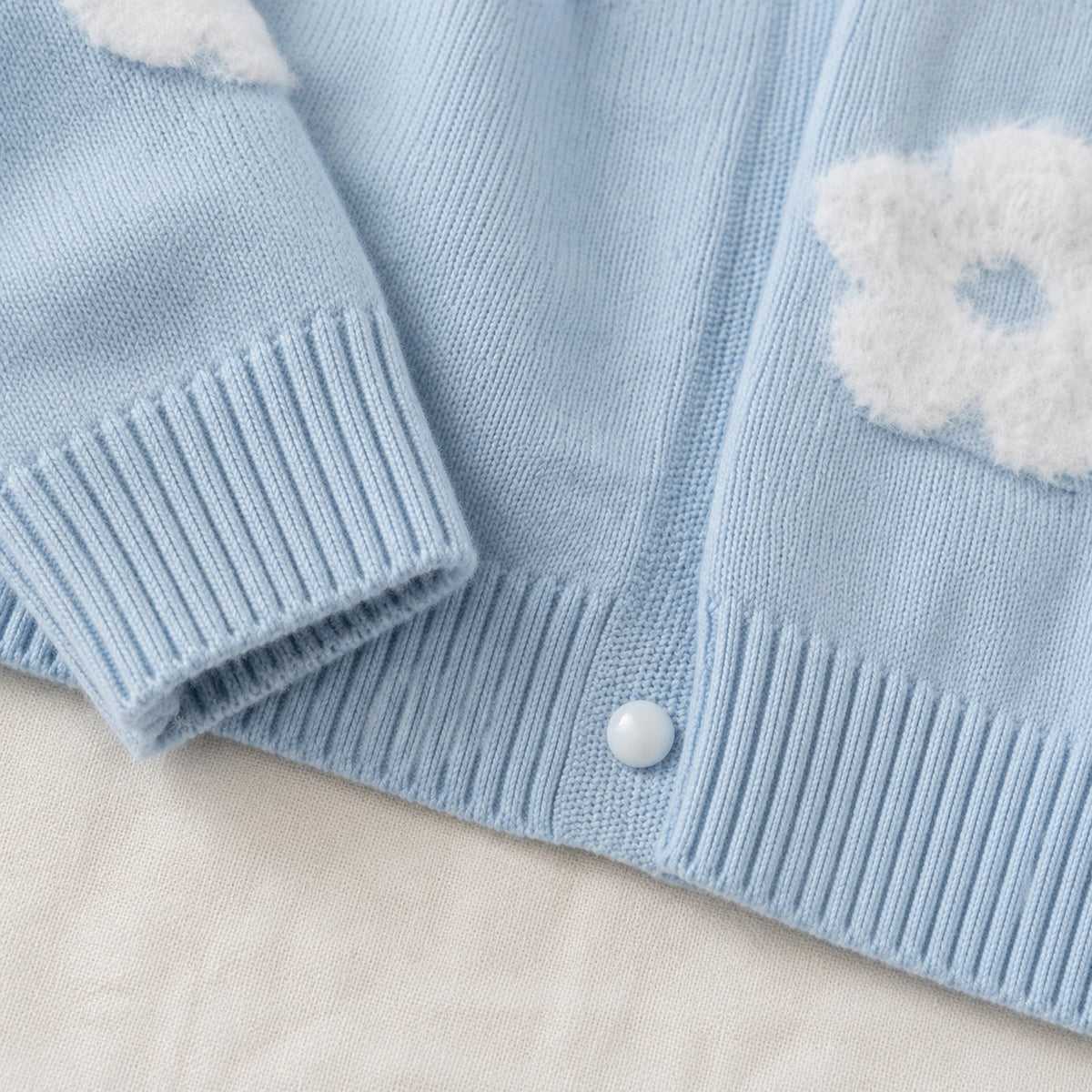 Girls' light blue knit cardigan ribbed cuff and hem detail