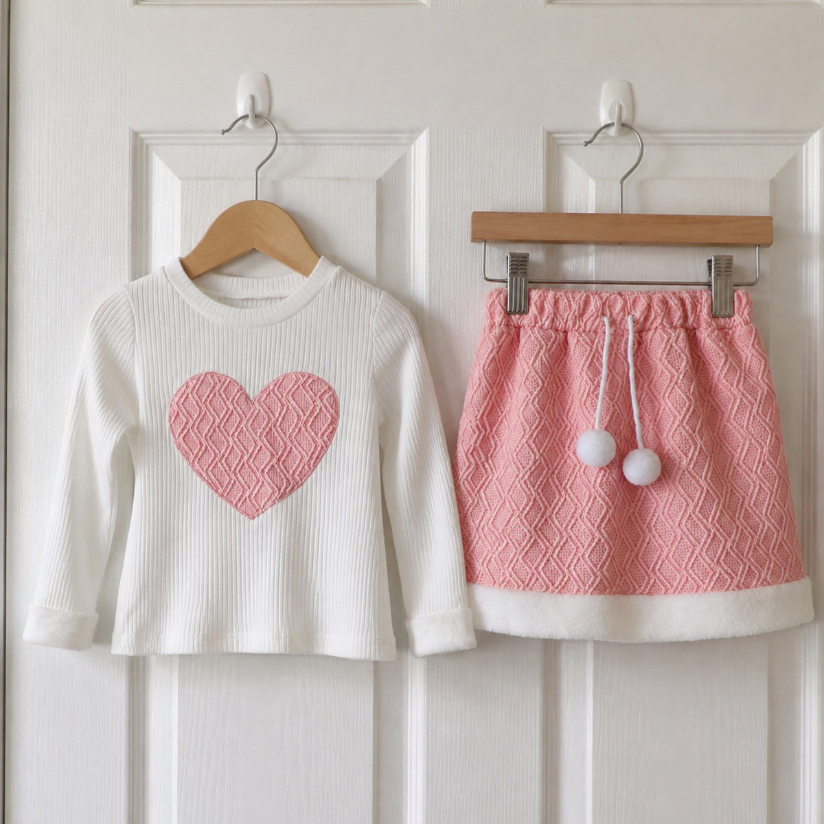 Heart long sleeve top and textured skirt on hangers