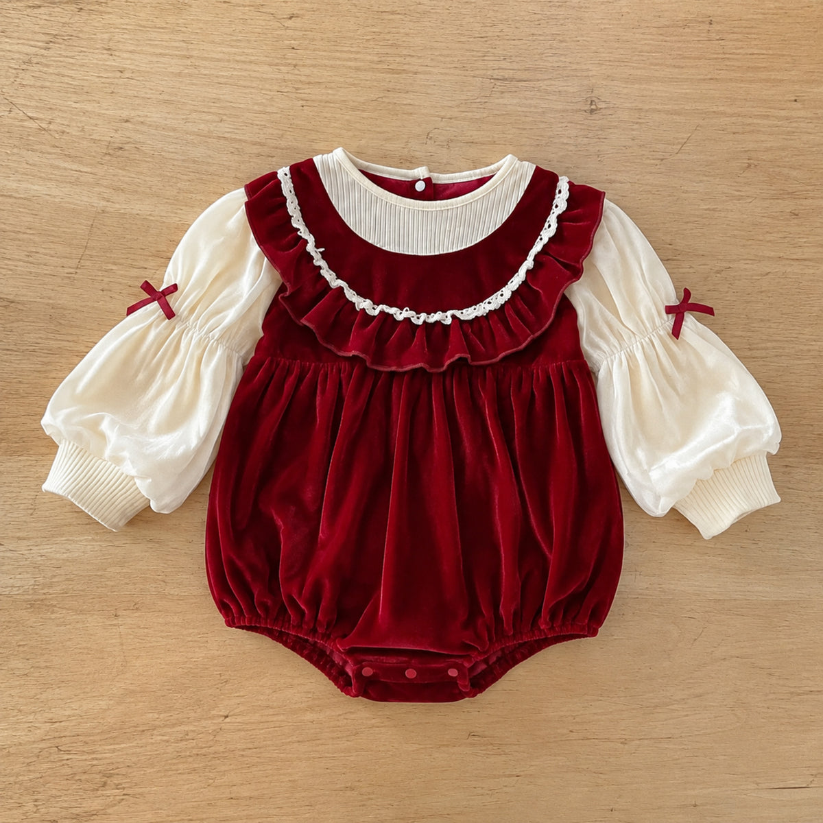 Crimson velvet look bubble romper flat lay