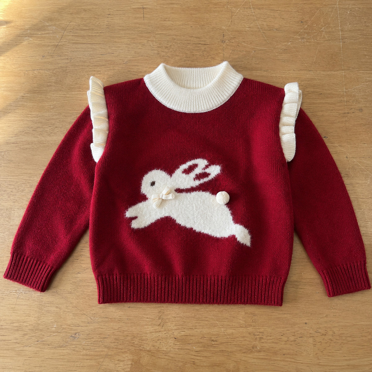 Deep red bunny pullover flat lay