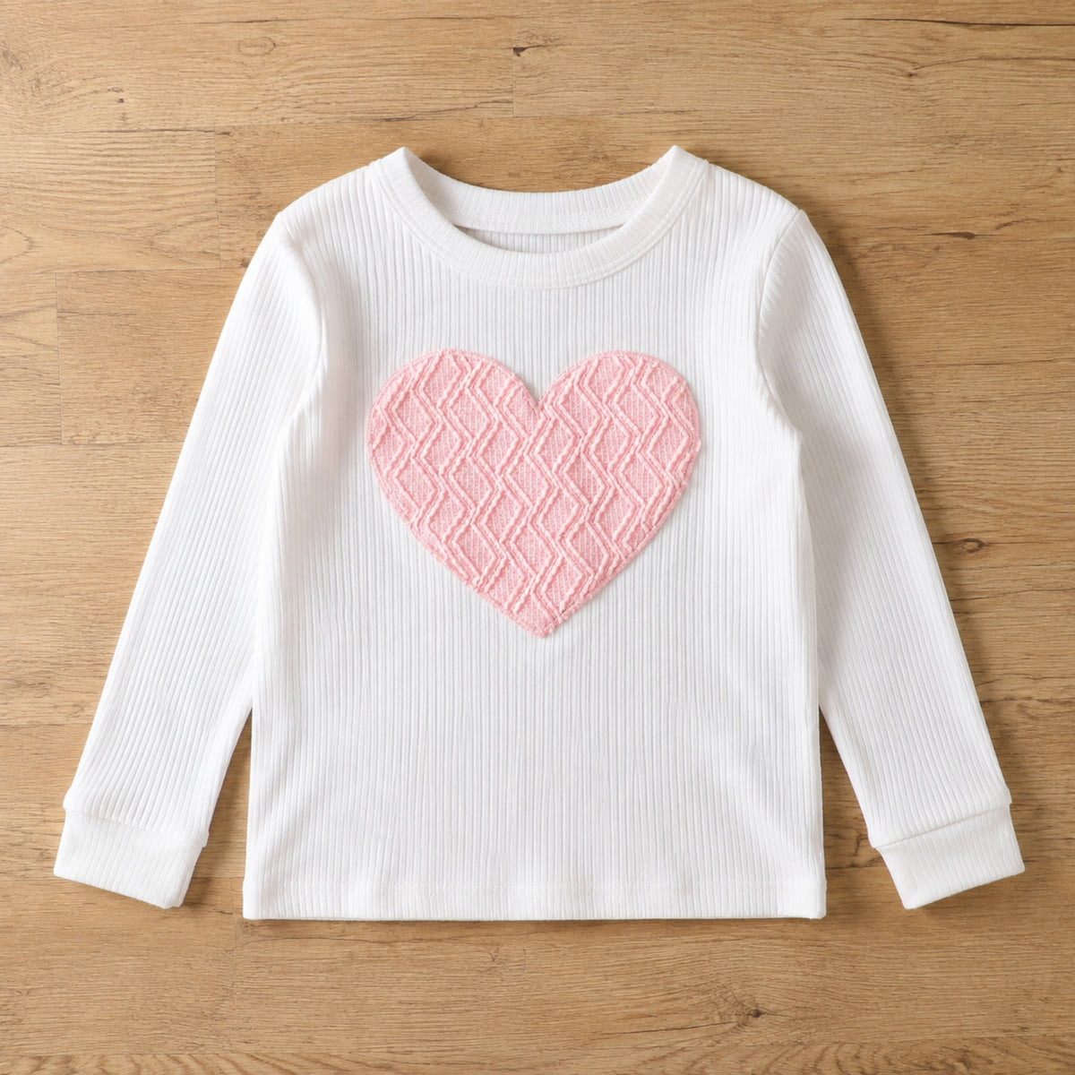 White ribbed long sleeve top with large pink heart