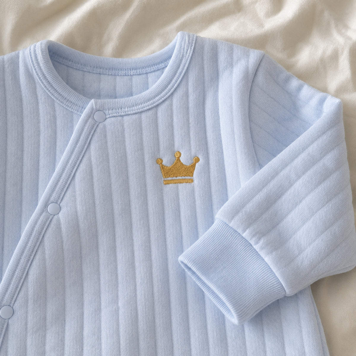 Gold crown embroidery and quilted cotton detail