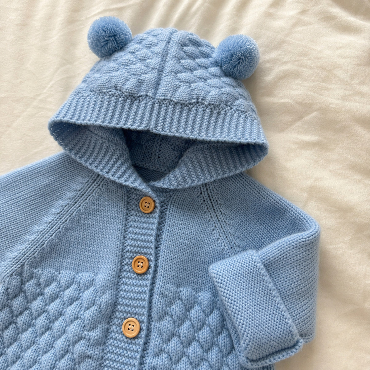Baby blue romper bear ears buttons and honeycomb knit detail