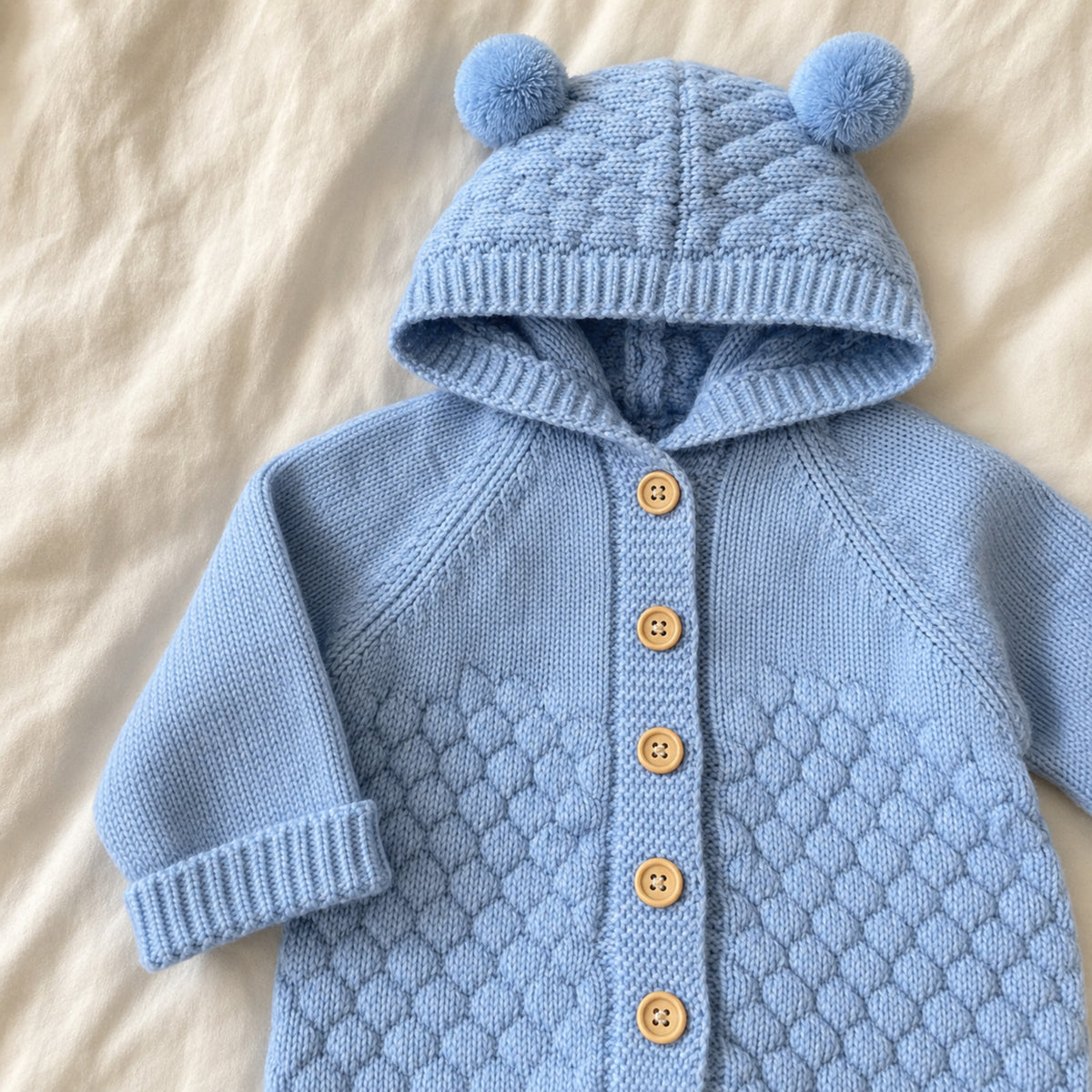 Wooden buttons and honeycomb knit texture detail