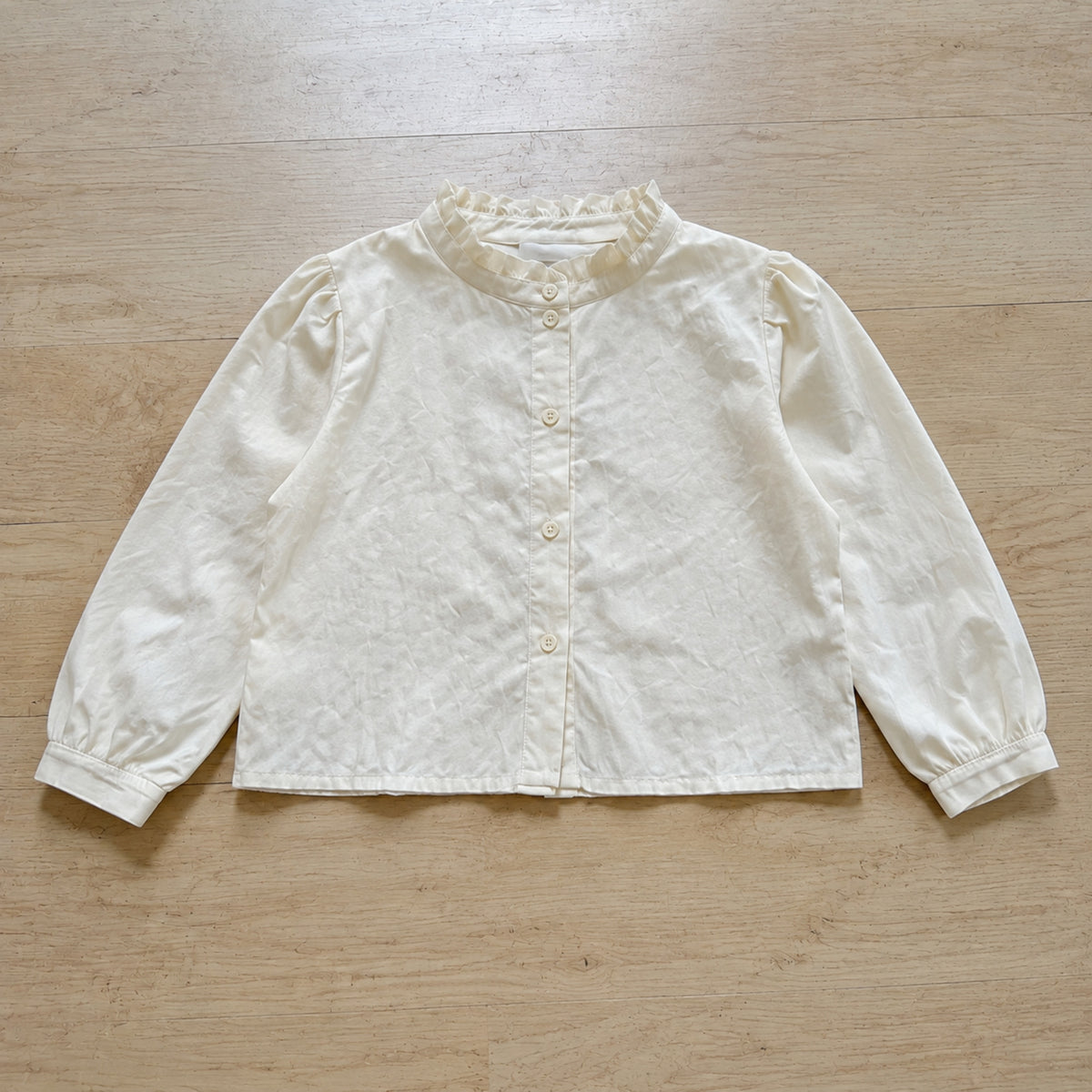 Ivory ruffle collar blouse and gathered cuff detail