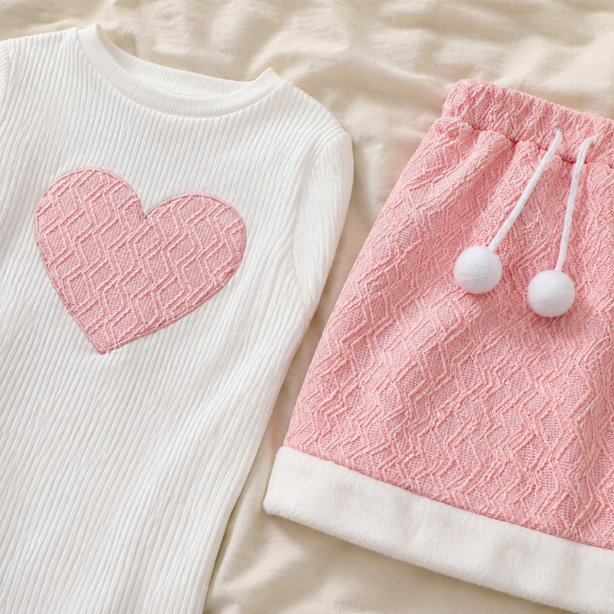 Pink heart applique and textured skirt fabric detail