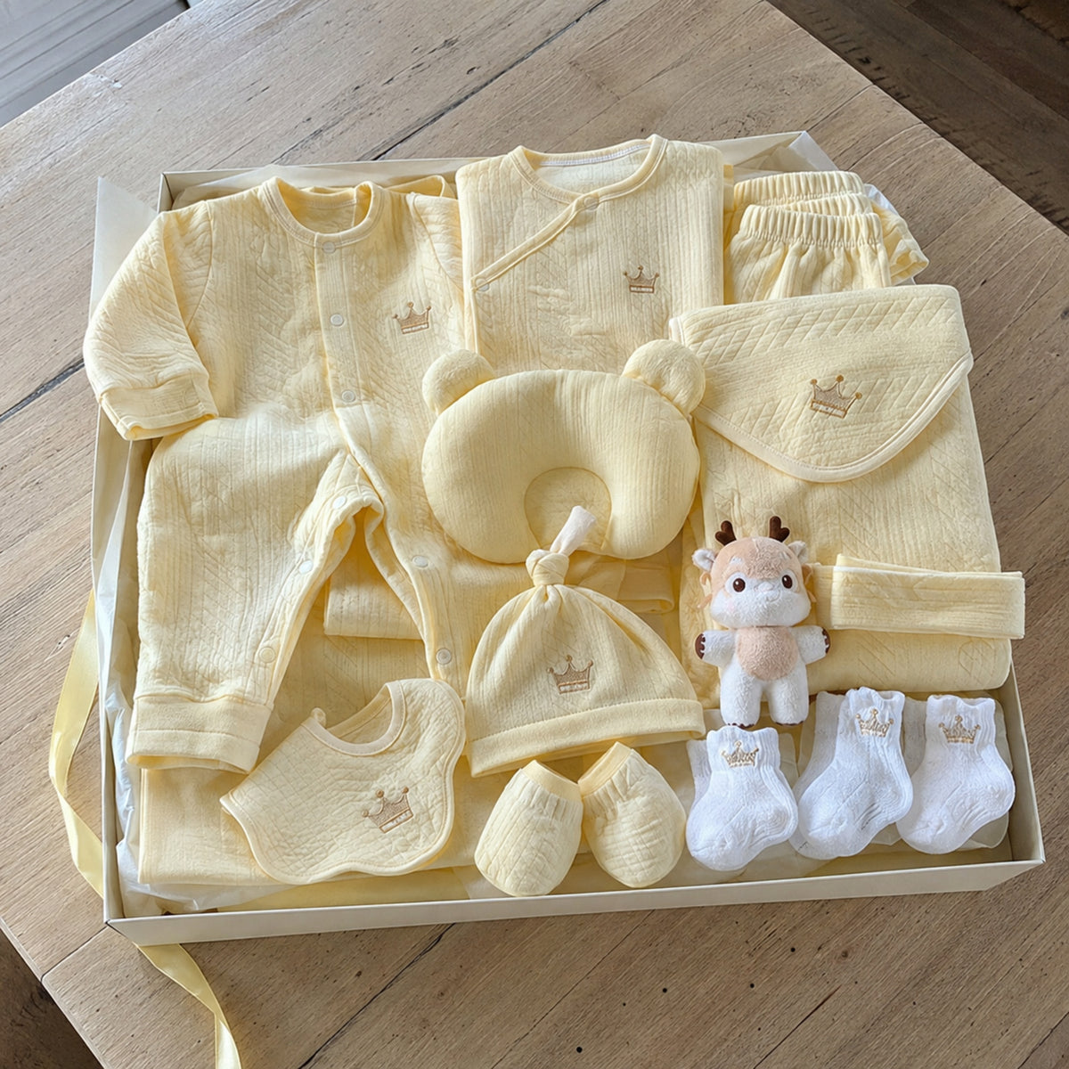 Soft yellow newborn layette gift box arrangement