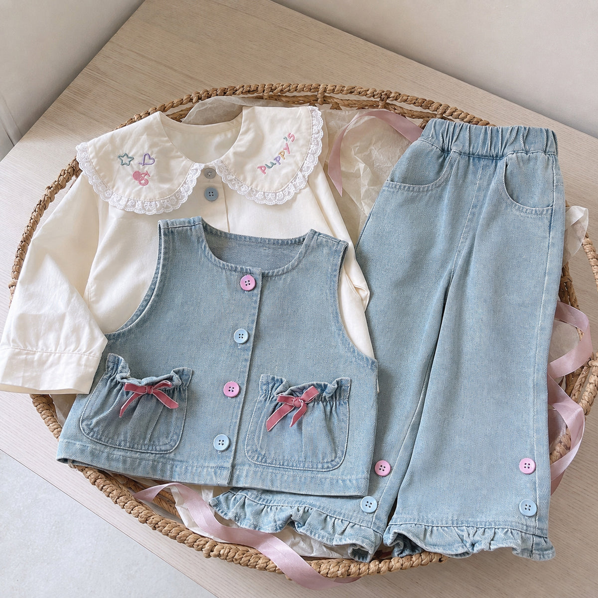 Girls denim three-piece clothing set arranged as a gift