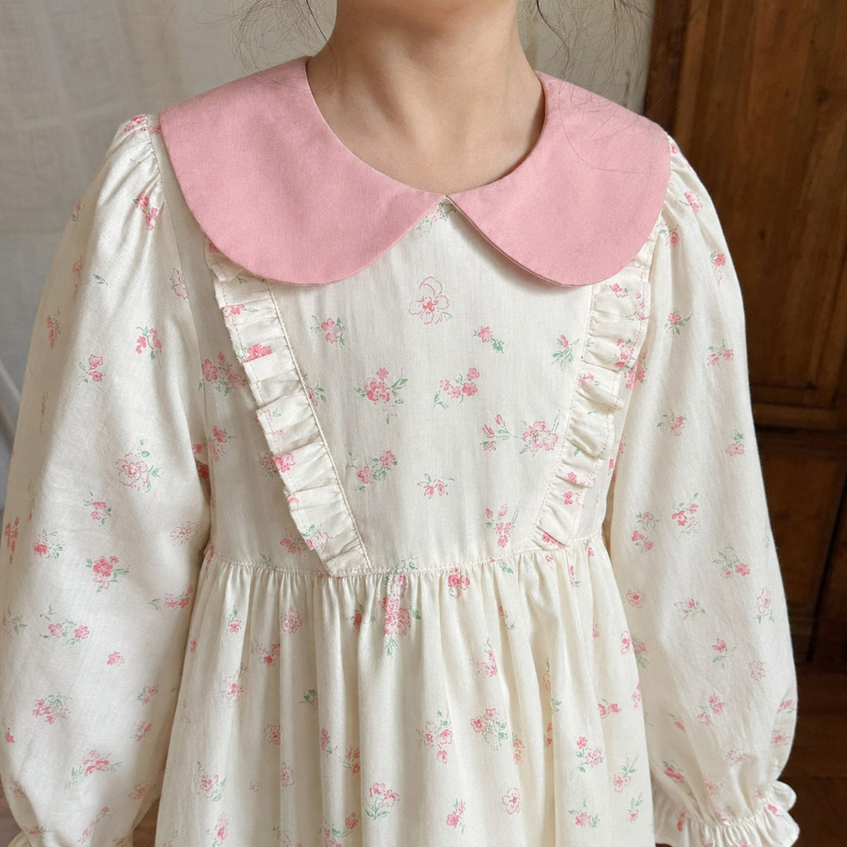Girls Ivory Floral Dress with Pink Peter Pan Collar — fabric and seam detail