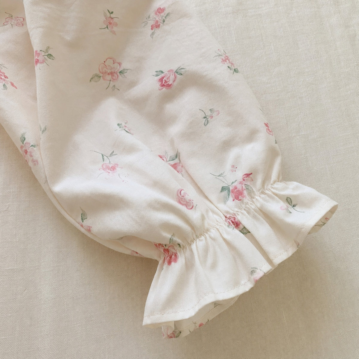 Girls Ivory Floral Dress with Pink Peter Pan Collar — hem and sleeve detail