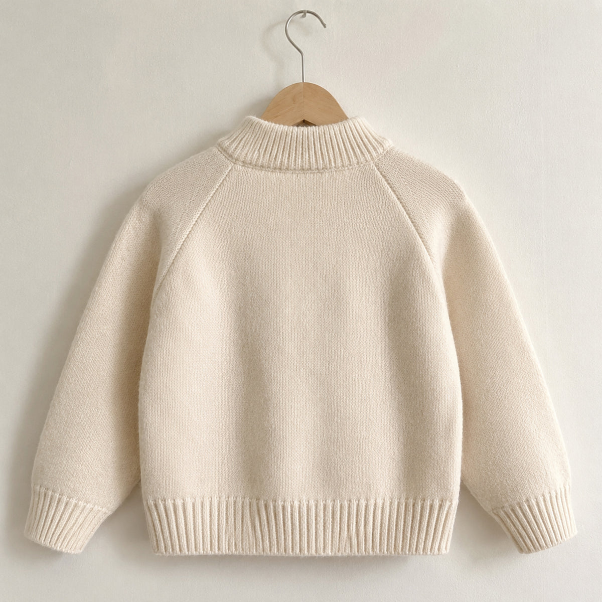 Plain back view of the off-white girls knit cardigan